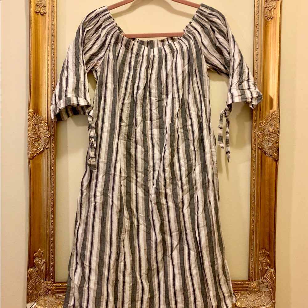 black, cream, and beige dress with ties on sleeves